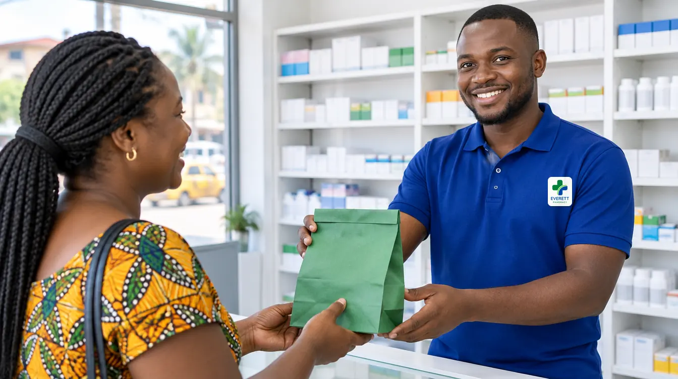 Illustration: a staff member in a blue Everett Pharmacy polo hands a customer a green collection bag.