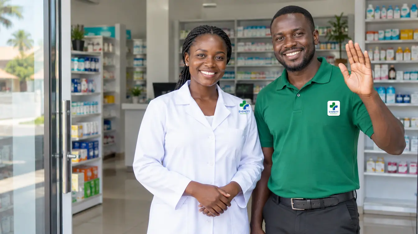 Illustration: two pharmacy staff in Everett Pharmacy white coat and green polo smile and wave in welcome.
